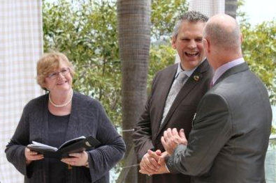 Craig & James with Jennifer Cram, gay
                    positive marriage celebrant